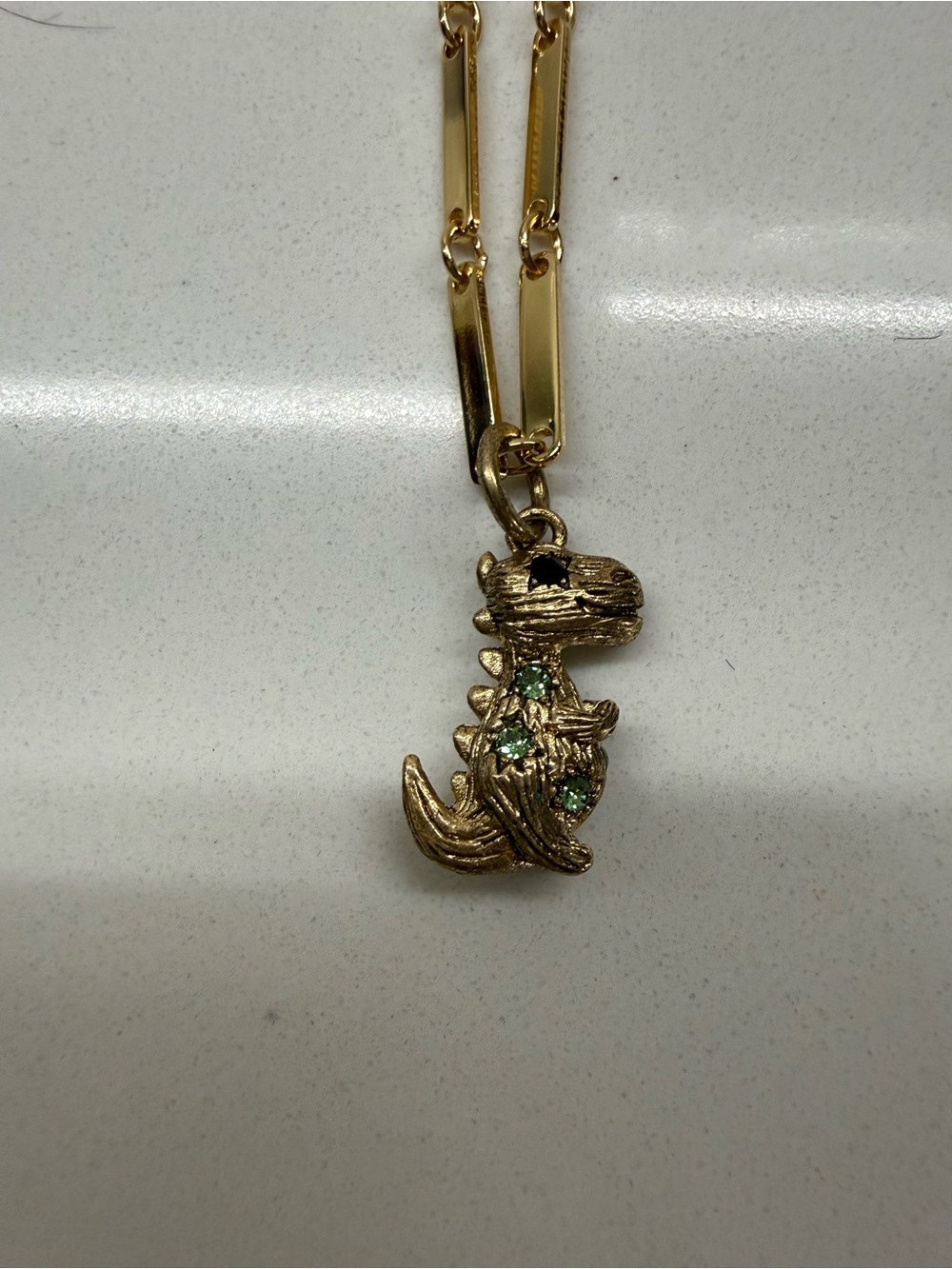 Coach Gold-Tone Dinosaur Pendant Necklace with Green Crystals